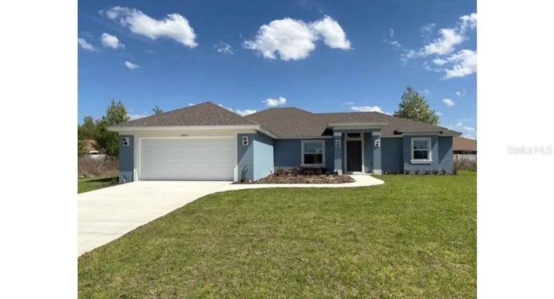Front exterior of a new home in , Ocala, FL, highlighting curb appeal (Image 1). Front exterior of a new home in , Ocala, FL, highlighting curb appeal (Image 1).