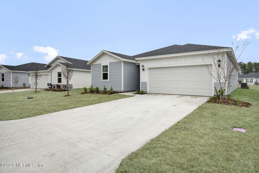 Front exterior of a new home in , Palm Coast, FL, highlighting curb appeal (Image 18). Front exterior of a new home in , Palm Coast, FL, highlighting curb appeal (Image 18).