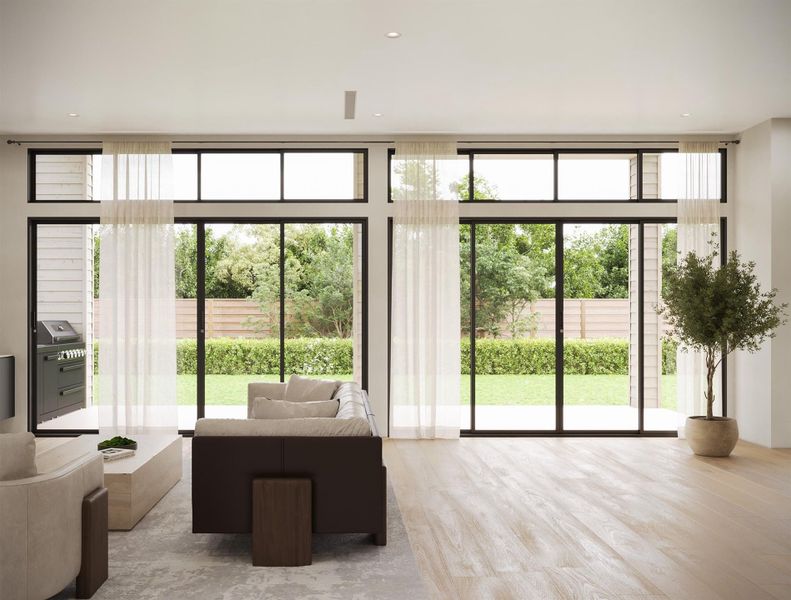 The view out to the spacious yard and shown with the outdoor kitchen (upgrade).