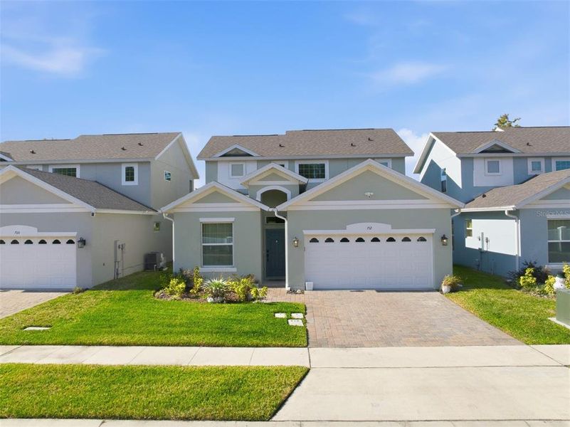Front exterior of a new home in Blue Diamond , Orlando, FL, highlighting curb appeal (Image 22). Front exterior of a new home in Blue Diamond , Orlando, FL, highlighting curb appeal (Image 22).