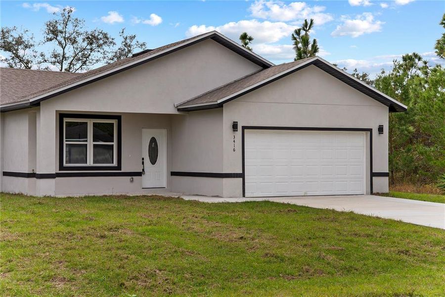 Front exterior of a new home in , Dunnellon, FL, highlighting curb appeal (Image 22).