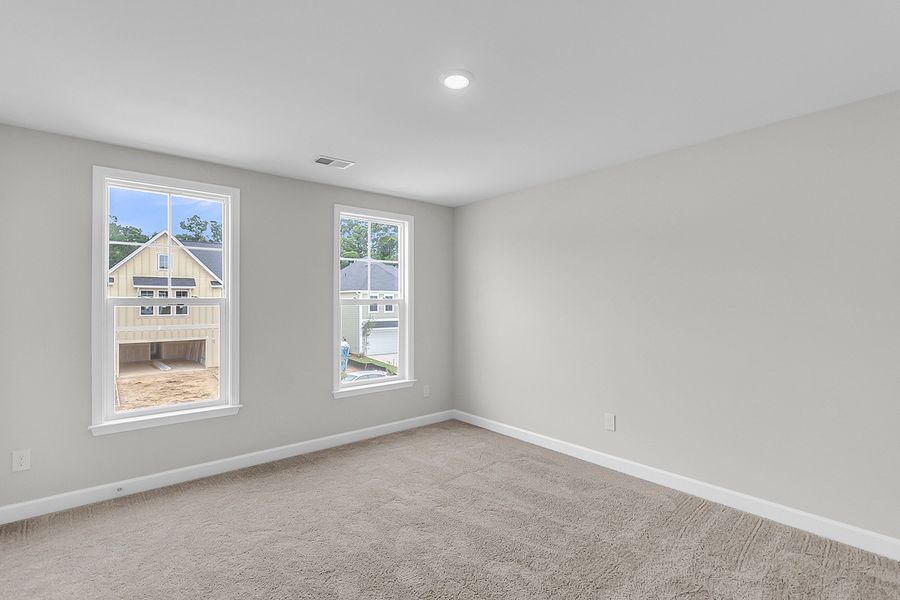 Spacious, unfurnished interior of a new home in Pineland Preserve, Summerville (Image 38).
