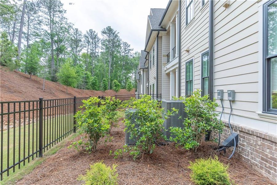 Front exterior of a new home in Waterside Condos, Peachtree Corners, GA, highlighting curb appeal (Image 1).