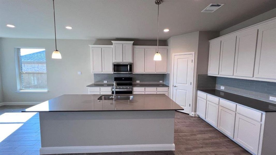 Kitchen- All Home and community information, including pricing, included features, terms, availability and amenities, are subject to change at any time without notice or obligation. All Drawings, pictures, photographs, video, square footages, floor plans, elevations, features, colors and sizes are approximate for illustration purposes only and will vary from the homes as built.