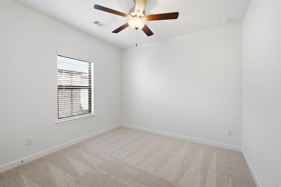 Neutral tone carpeting with white baseboards and walls Neutral tone carpeting with white baseboards and walls
