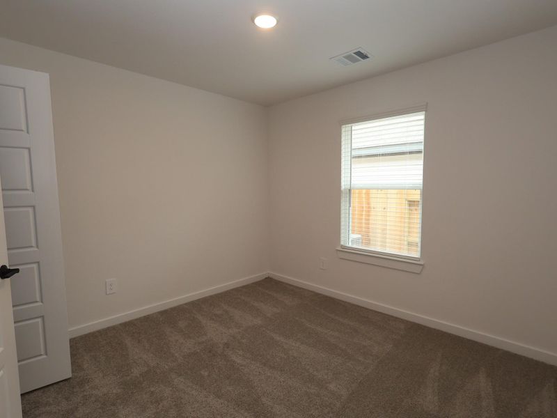 Spacious, unfurnished interior of a new home in Lone Star Landing, Montgomery (Image 13).