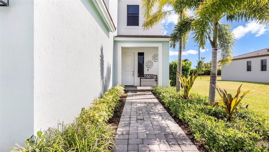 Front exterior of a new home in , Loxahatchee, FL, highlighting curb appeal (Image 23).