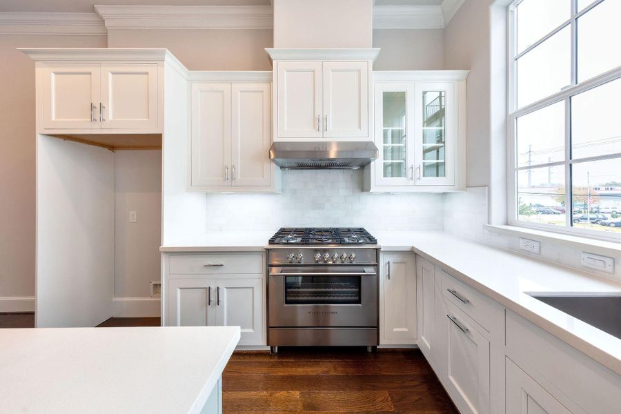 Gorgeous Aspect branded furniture grade wood cabinets with white marble backsplash and wood floors and SS Bosch appliances Gorgeous Aspect branded furniture grade wood cabinets with white marble backsplash and wood floors and SS Bosch appliances