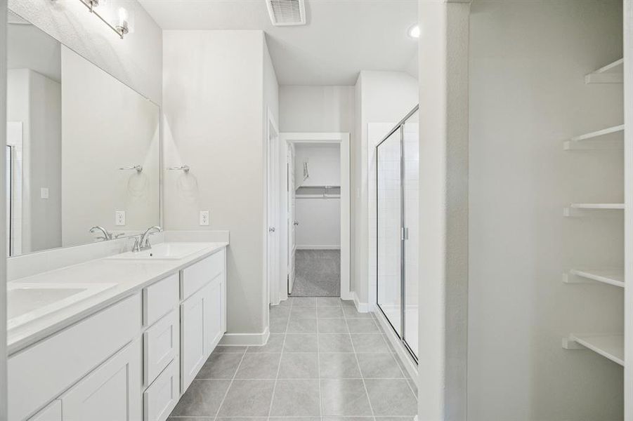 Primary Bathroom in the Oscar home plan by Trophy Signature Homes – REPRESENTATIVE PHOTO Primary Bathroom in the Oscar home plan by Trophy Signature Homes – REPRESENTATIVE PHOTO