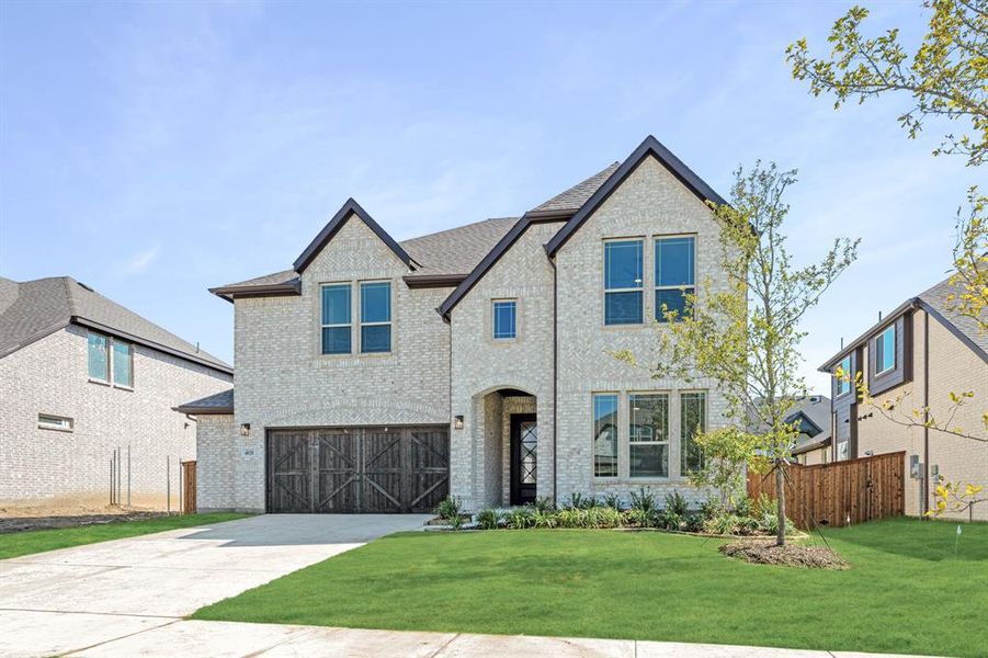 Front exterior of a new home in Windsong Ranch Classic 61, Prosper, TX, highlighting curb appeal (Image 1). Front exterior of a new home in Windsong Ranch Classic 61, Prosper, TX, highlighting curb appeal (Image 1).