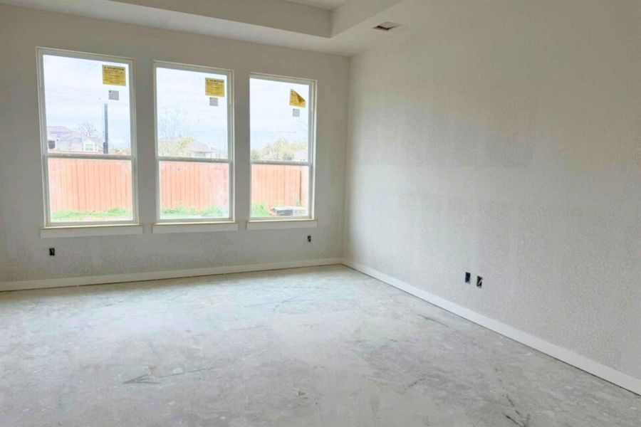 Empty room featuring baseboards