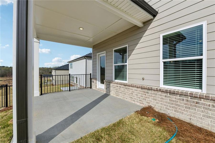Exterior details and patio area of a home in Preserve at Mountain Creek, Pendergrass (Image 25).