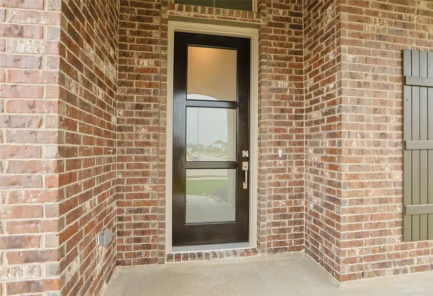 Exterior details and patio area of a home in Sunterra, Katy (Image 2). Exterior details and patio area of a home in Sunterra, Katy (Image 2).