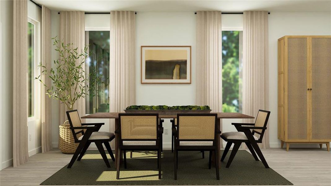 Dining space featuring a healthy amount of sunlight and light wood-type flooring