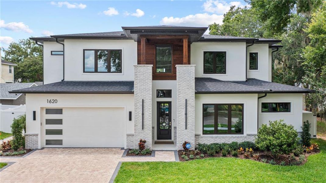 Front exterior of a new home in , Orlando, FL, highlighting curb appeal (Image 2). Front exterior of a new home in , Orlando, FL, highlighting curb appeal (Image 2).