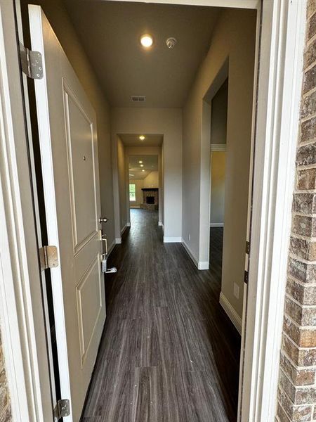 Hallway with dark wood-type flooring