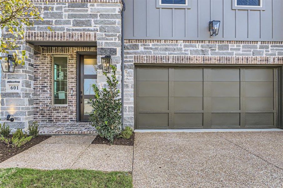 Doorway to property featuring a garage