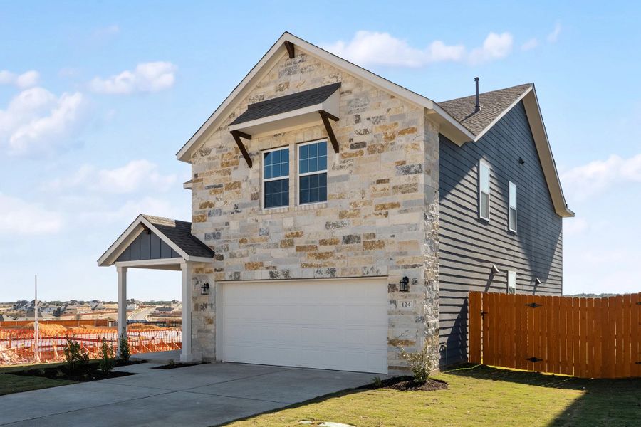Front exterior of a new home in The Homestead at Lariat, Liberty Hill, TX, highlighting curb appeal (Image 27).