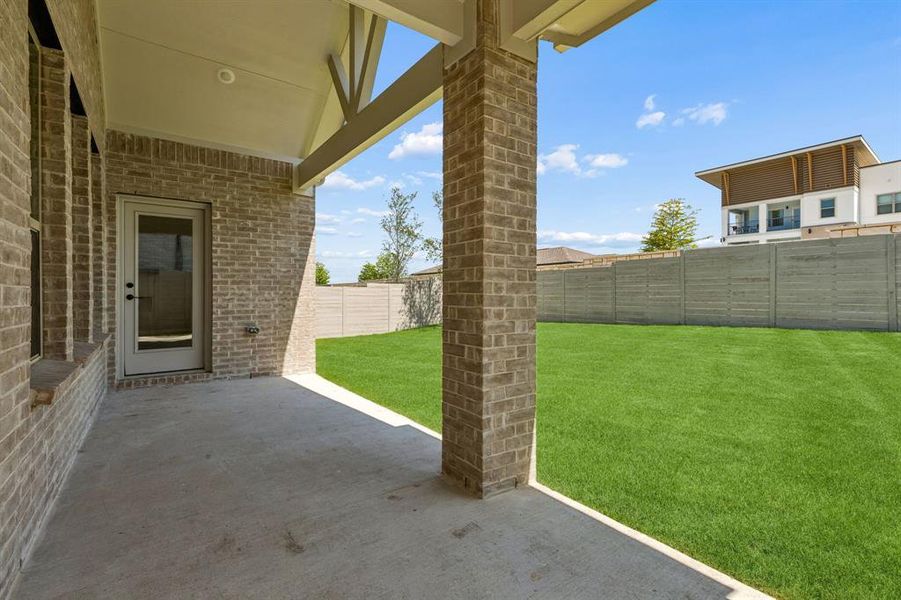 Exterior details and patio area of a home in Painted Tree Woodland West, McKinney (Image 4).