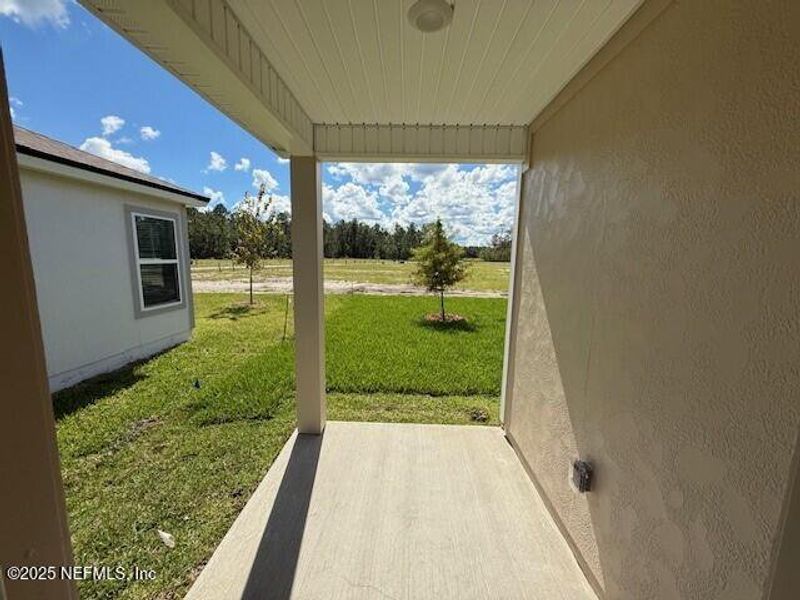 Exterior details and patio area of a home in Grand Reserve, Bunnell (Image 1).