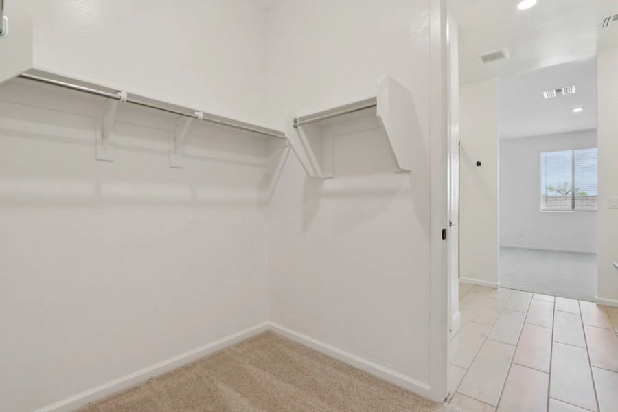 Primary walk in closet. Options and finishes may vary by community. Primary walk in closet. Options and finishes may vary by community.