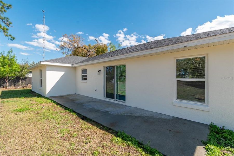 Exterior details and patio area of a home in , Summerfield (Image 20).