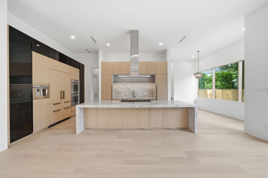 richarchitectural detailing, and designer-selected finishes throughout centered around an impressive chef's kitchen with acomplete Thermador Professional appliance package