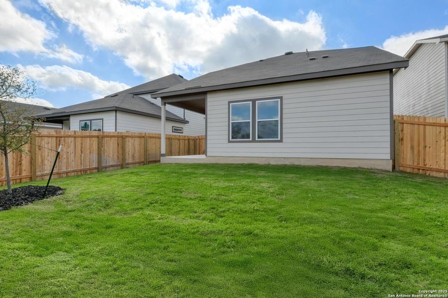 Exterior details and patio area of a home in Meadows at Hennersby Hollow 40's, San Antonio (Image 23).