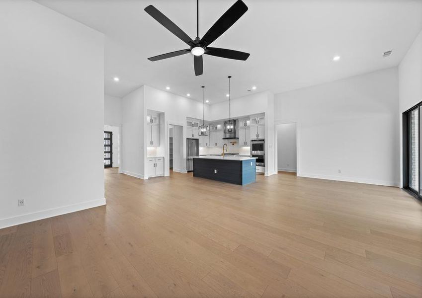 The open layout connects the kitchen with the breakfast area and family room.