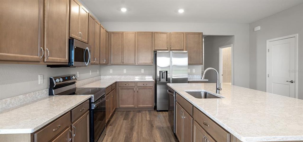 Furnished interior view inside a new home in Estates at Hickory Cove - Bungalows, St. Cloud (Image 6).