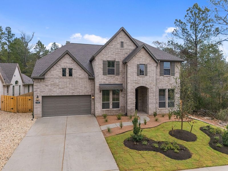 Front exterior of a new home in Colton, Montgomery, TX, highlighting curb appeal (Image 22).
