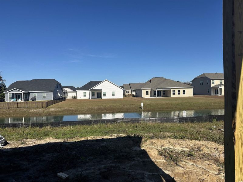 View of yard with a water view and a residential view