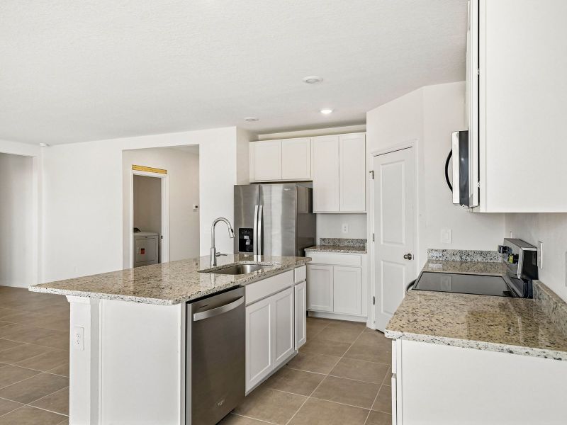 Furnished interior view inside a new home in The Reserve at Van Oaks, Auburndale (Image 4).