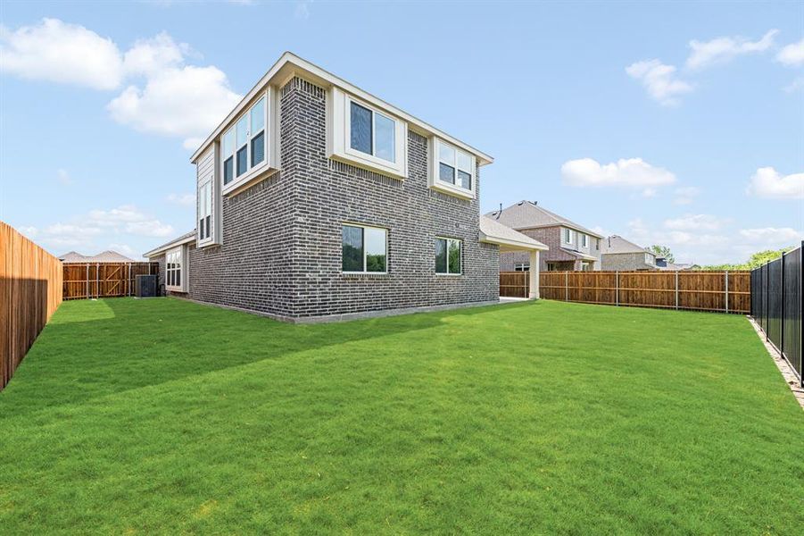 Front exterior of a new home in Sable Creek, Sanger, TX, highlighting curb appeal (Image 22). Front exterior of a new home in Sable Creek, Sanger, TX, highlighting curb appeal (Image 22).