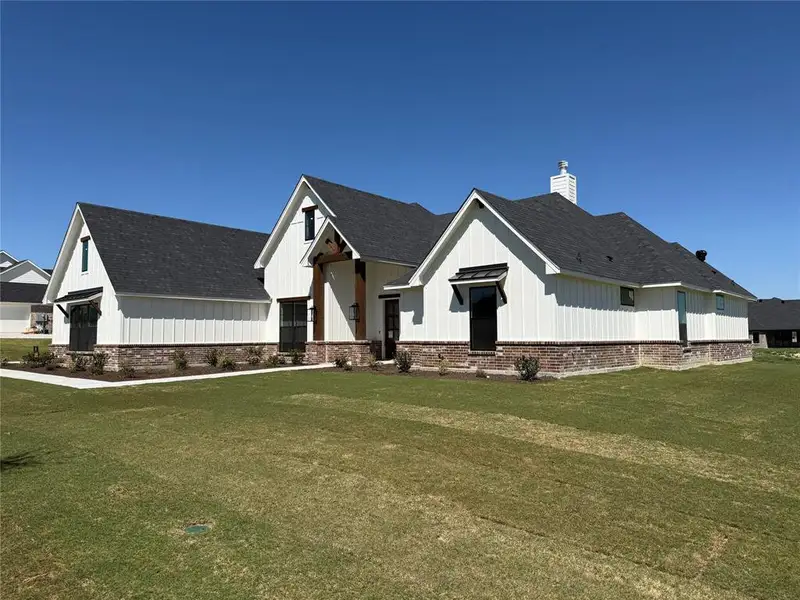 Front exterior of a new home in , Aledo, TX, highlighting curb appeal (Image 3).