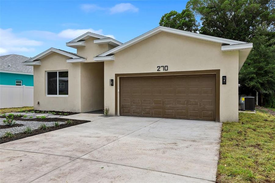 Front exterior of a new home in , Dunedin, FL, highlighting curb appeal (Image 28).