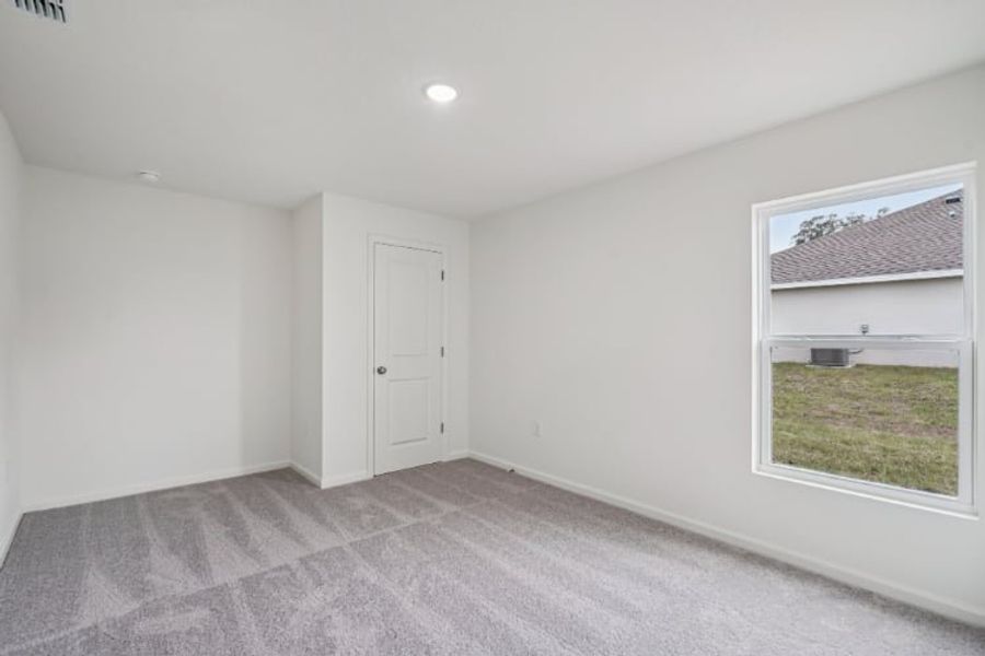 A room with a window and a door.