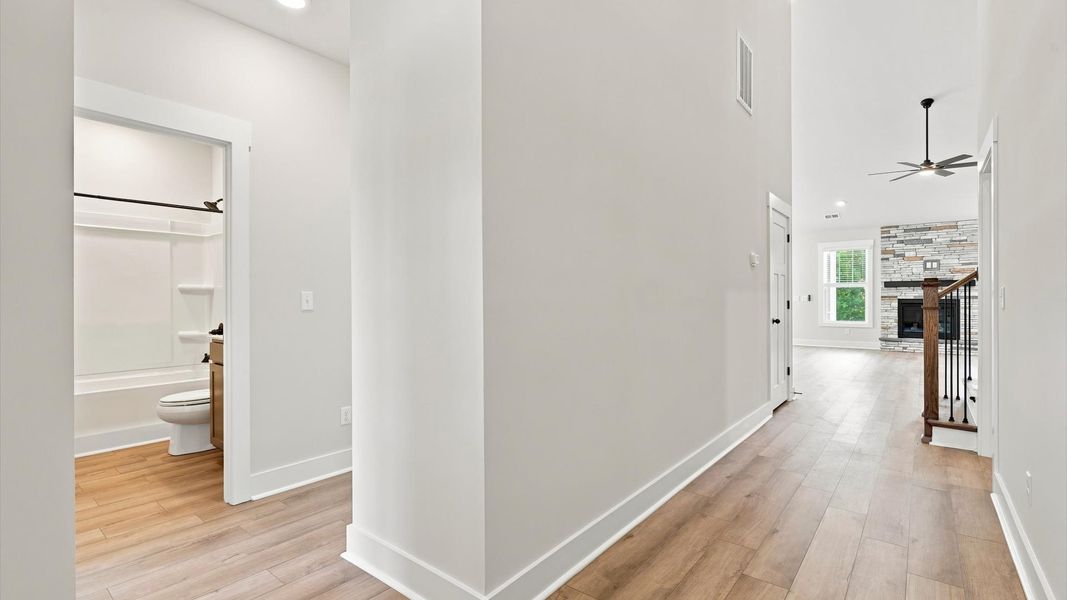 Superior design begins at the front door with a hardwood floor foyer and elegant sightlines