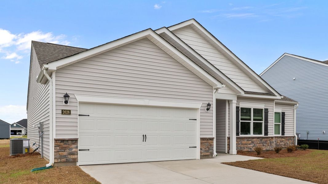 Front exterior of a new home in Villa Grande, Winterville, NC, highlighting curb appeal (Image 14). Front exterior of a new home in Villa Grande, Winterville, NC, highlighting curb appeal (Image 14).