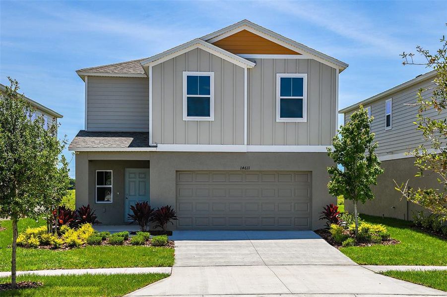 Front exterior of a new home in Crosswinds, Haines City, FL, highlighting curb appeal (Image 1). Front exterior of a new home in Crosswinds, Haines City, FL, highlighting curb appeal (Image 1).