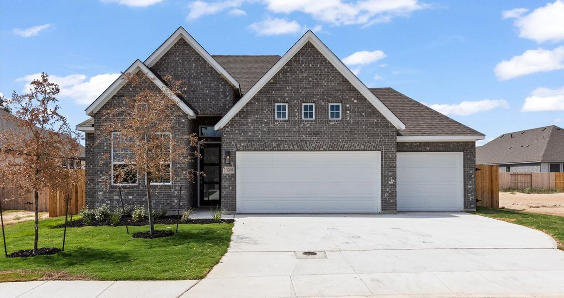 Front exterior of a new home in Village at Three Oaks, Seguin, TX, highlighting curb appeal (Image 1). Front exterior of a new home in Village at Three Oaks, Seguin, TX, highlighting curb appeal (Image 1).