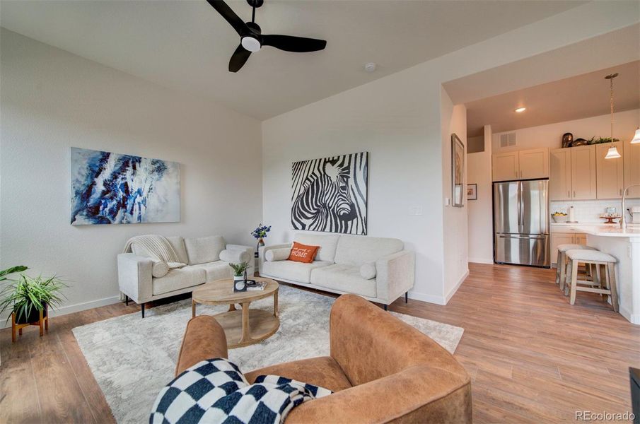 Open concept floor plan connects the living room with the kitchen and dining areas with the living room.