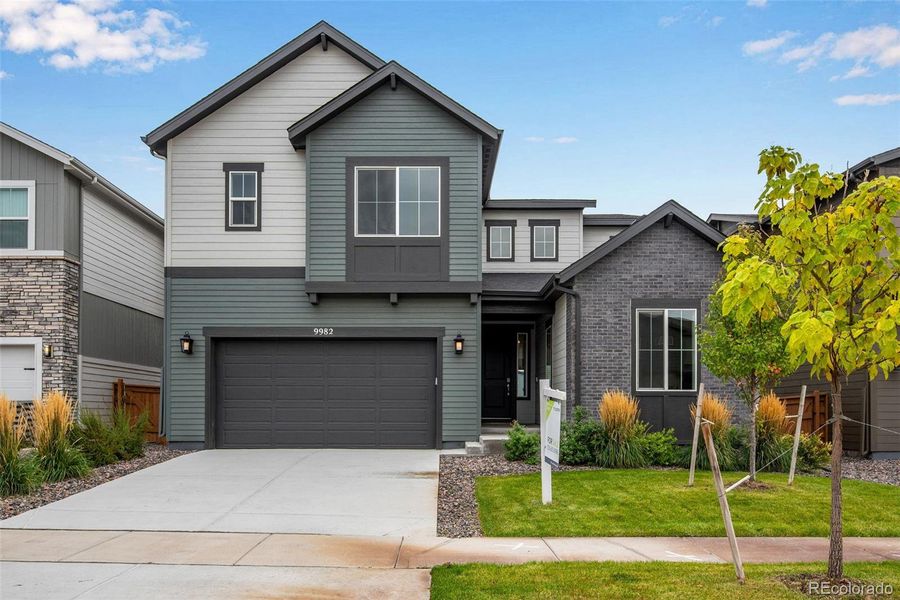Front exterior of a new home in Reunion Ridge, Commerce City, CO, highlighting curb appeal (Image 24).