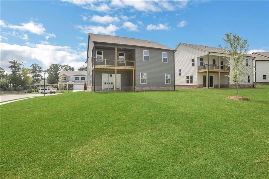 Exterior details and patio area of a home in The Paddocks at Doc Hughes, Buford (Image 4).