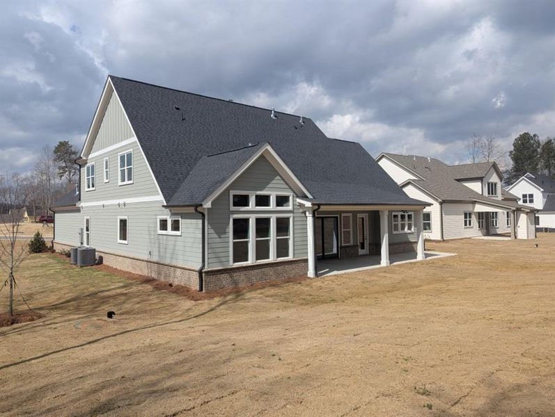 Exterior details and patio area of a home in Arden on Lanier, Cumming (Image 22).