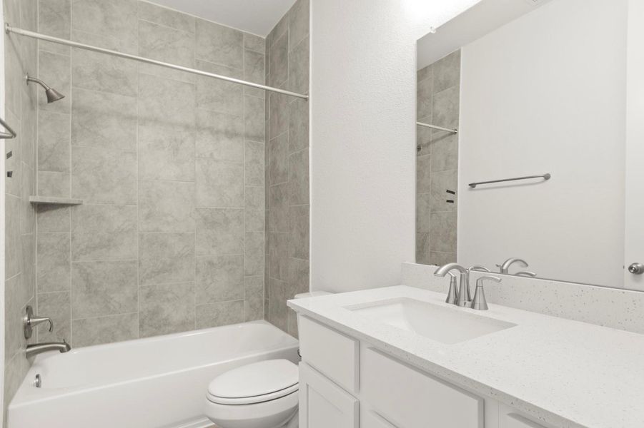 Bathroom featuring vanity and tub / shower combination