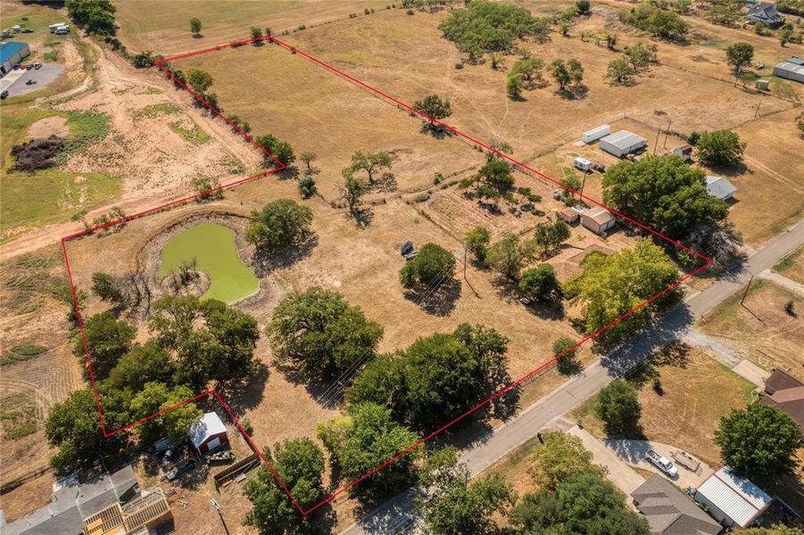 Aerial View of Acreage, Home, and Tank