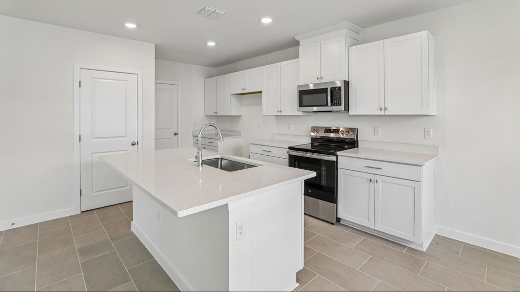 Furnished interior view inside a new home in Cyrene at Harmony, St. Cloud (Image 10).