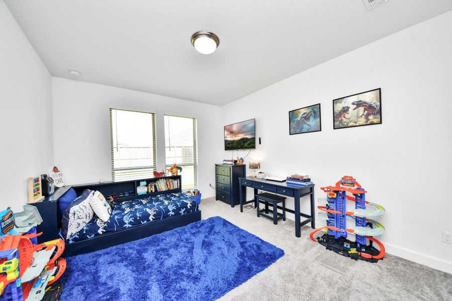 Spacious bedroom suitable for kids, guests, or office.