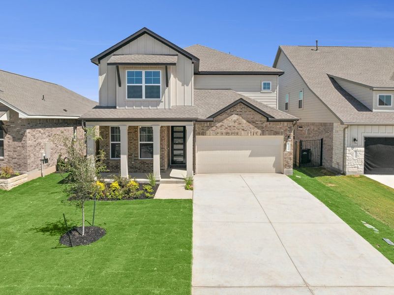 Front exterior of a new home in Santa Rita Ranch, Georgetown, TX, highlighting curb appeal (Image 2). Front exterior of a new home in Santa Rita Ranch, Georgetown, TX, highlighting curb appeal (Image 2).